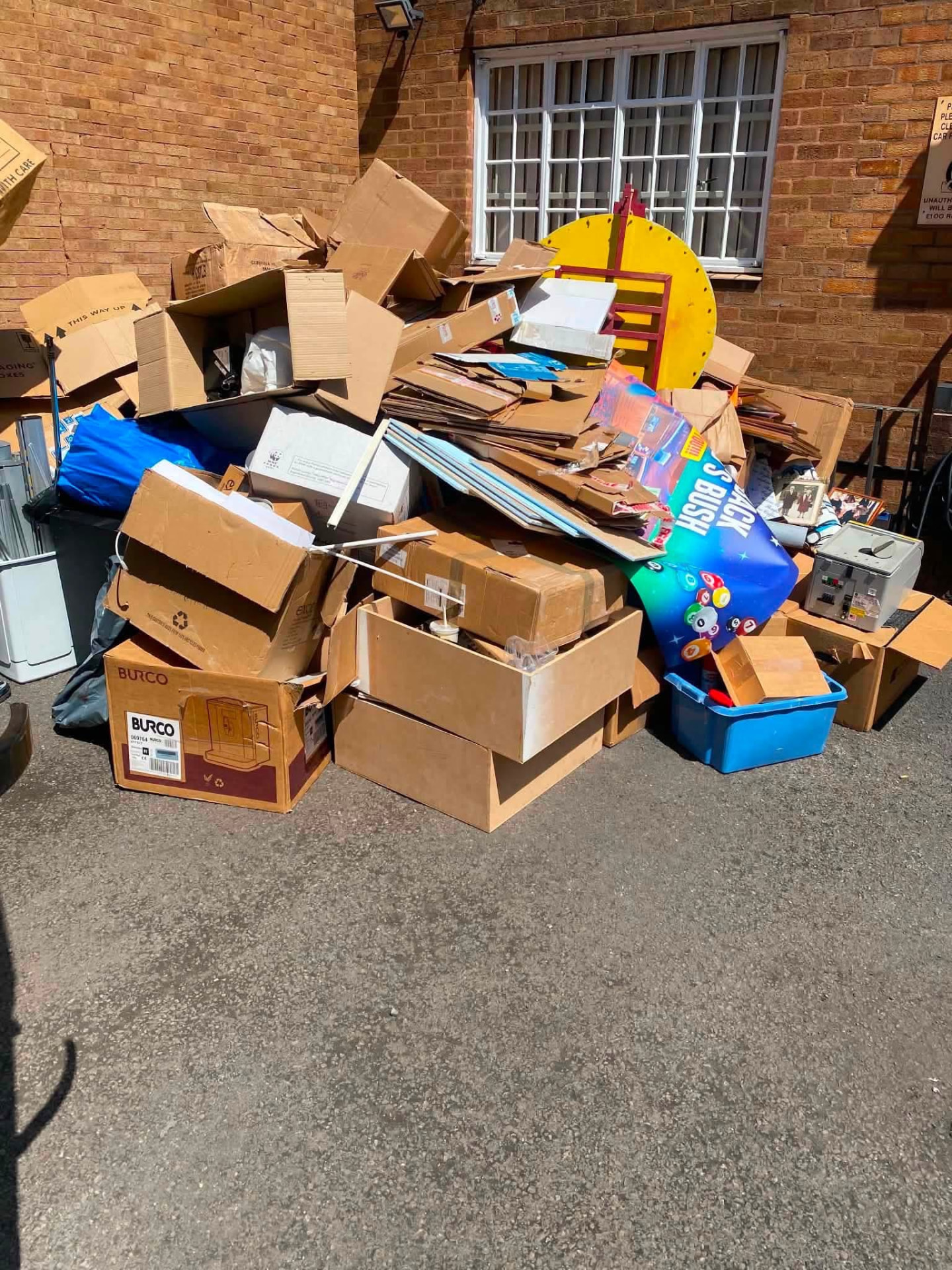 A large pile of flattened cardboard and packaging cleared from a business car park in Birmingham