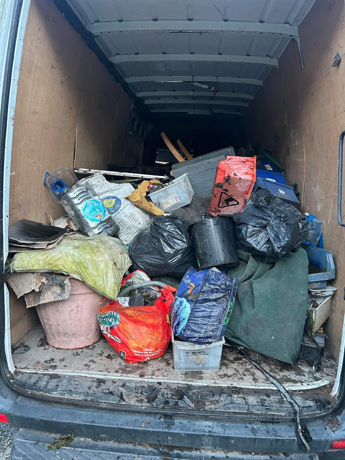 Household rubbish and waste clearance job loaded from a driveway in the West Midlands